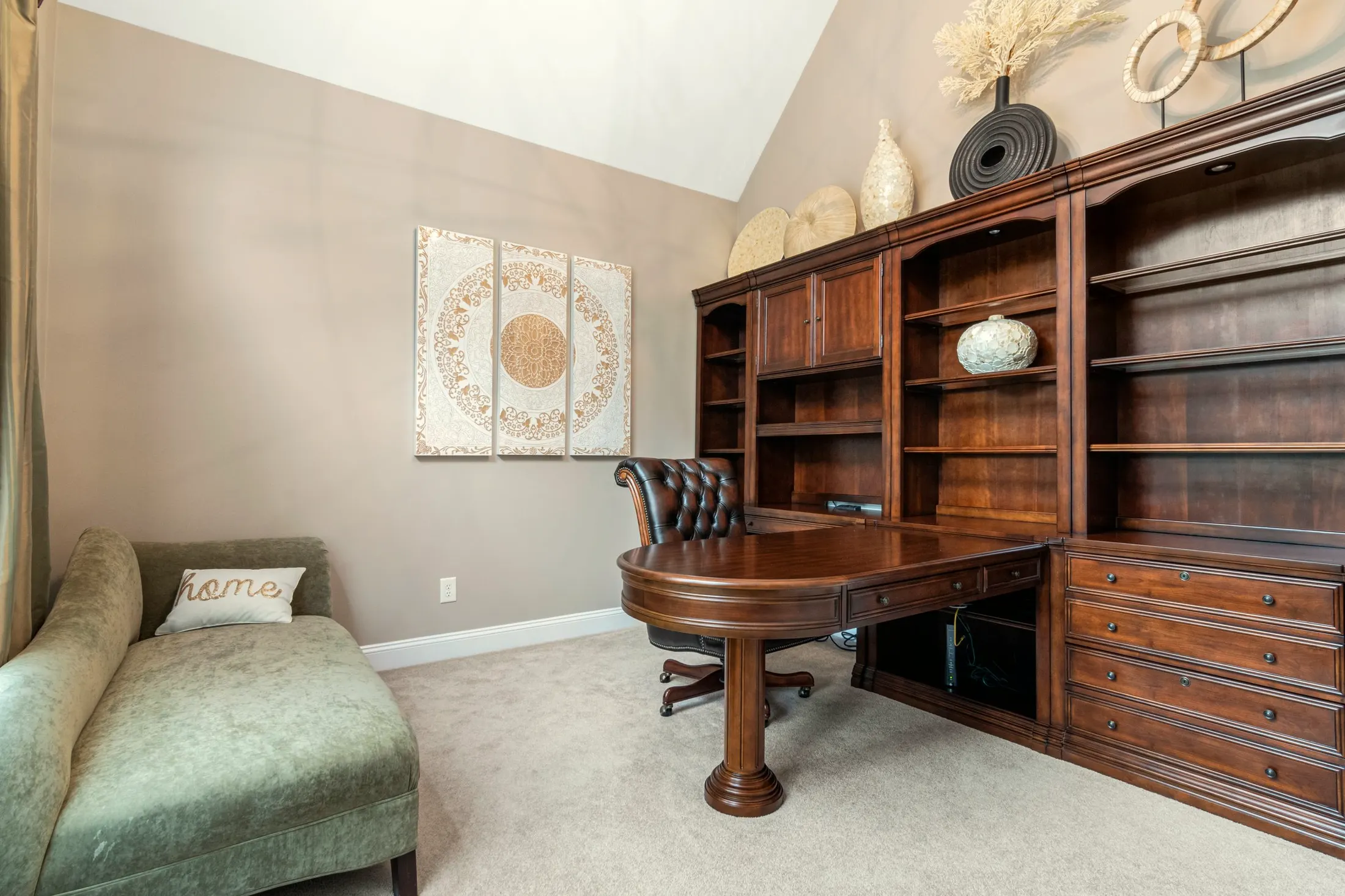 Study with a desk and dark-wood built-in bookcases